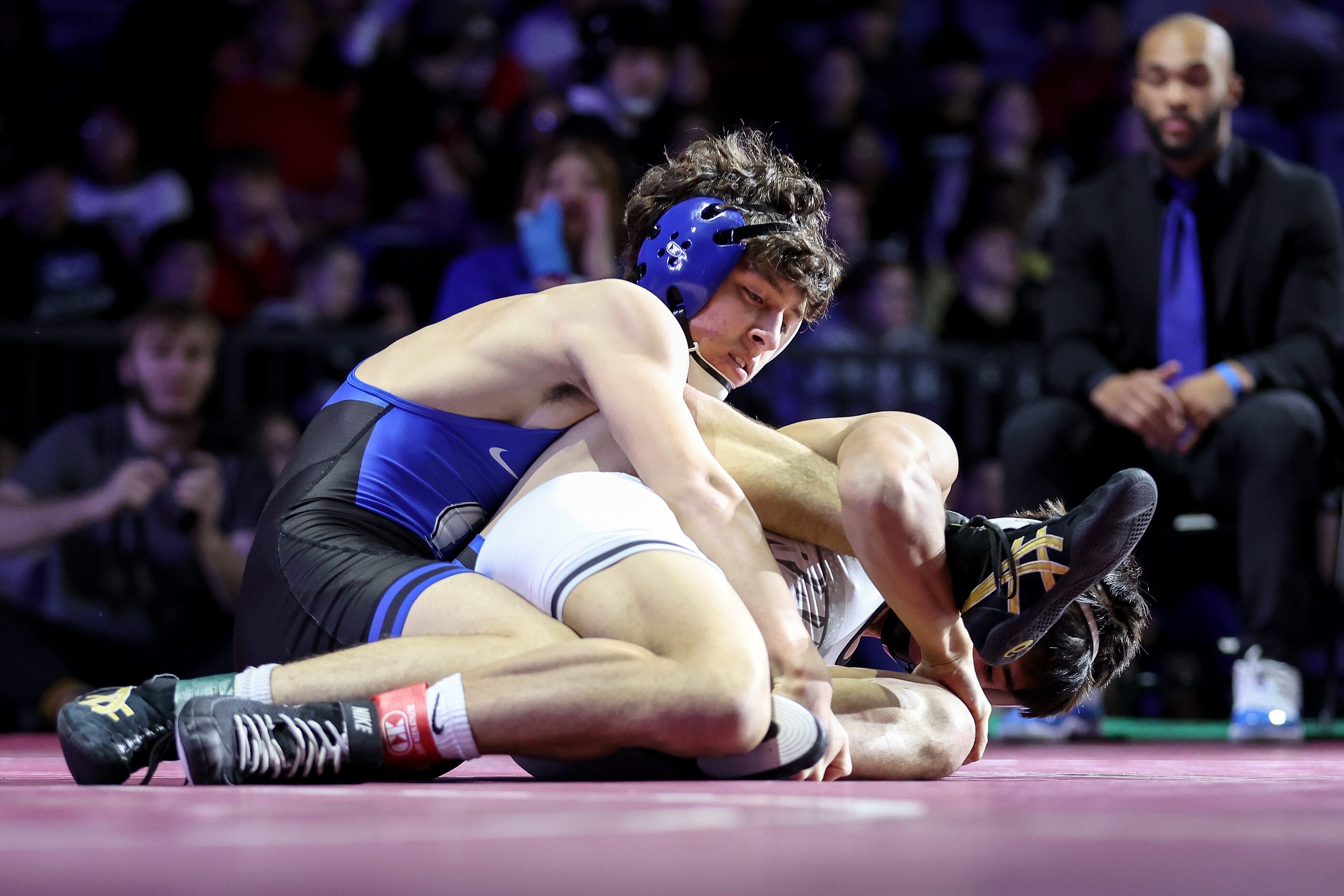 Eli Biermann of Midlothian (blue) competes against Nathaniel Ruiz of Canyon Randall  Boys 5A...