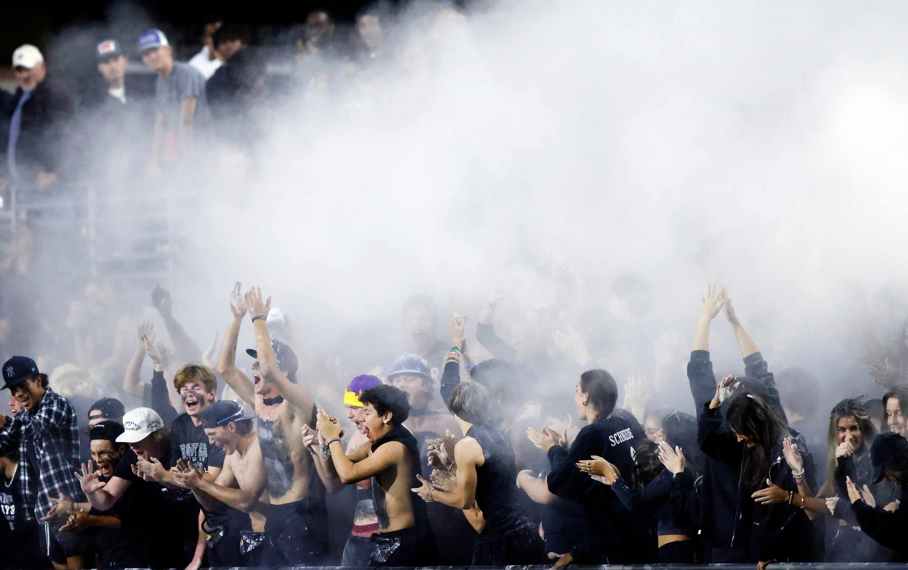 The Denton Guyer students tossed talc powder in the air during the second half against Allen...