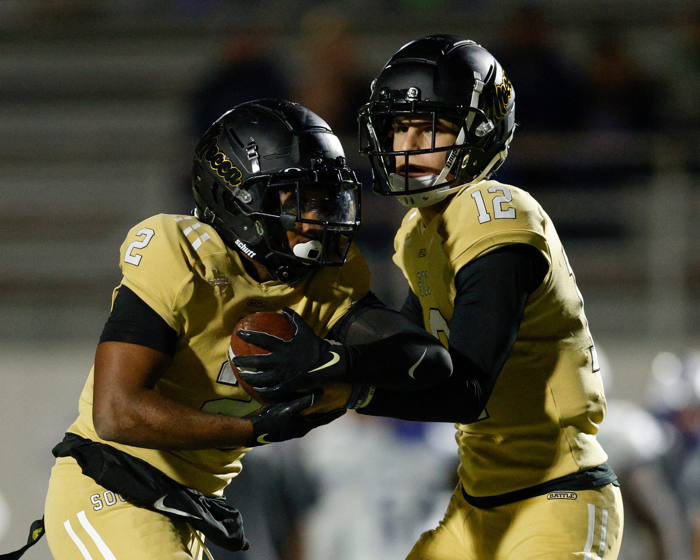 South Oak Cliff quarterback Carter Kopecky (12) hands the ball to running back Tedrick...