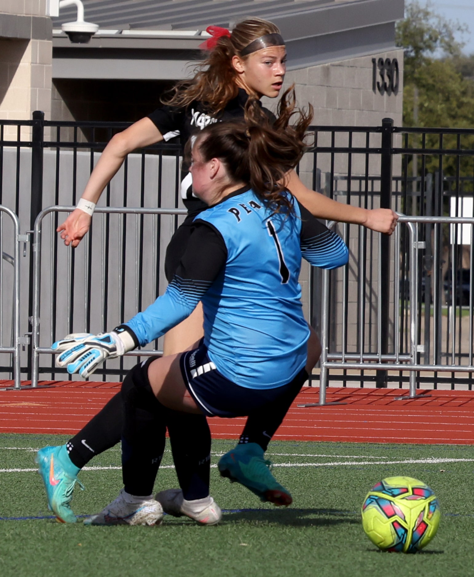 Flower Mound Marcus forward Madi Patterson (17) scores around the defense of Richardson JJ...