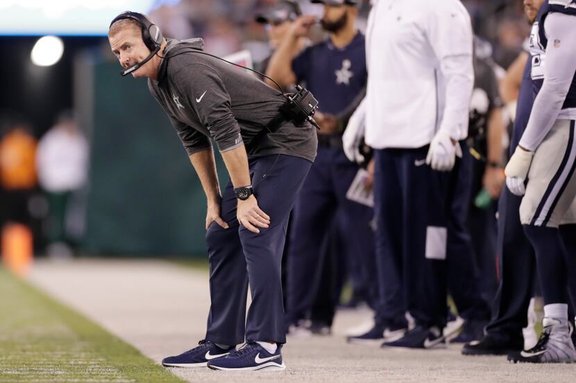 Dallas Cowboys head coach Jason Garrett looks over the field during the second half of an...