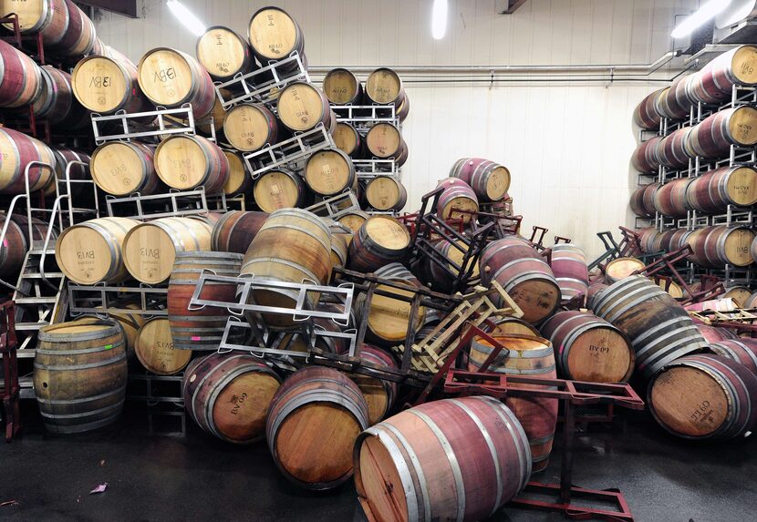 Barrels are strewn about inside the storage room of Bouchaine Vineyards in Napa in downtown...