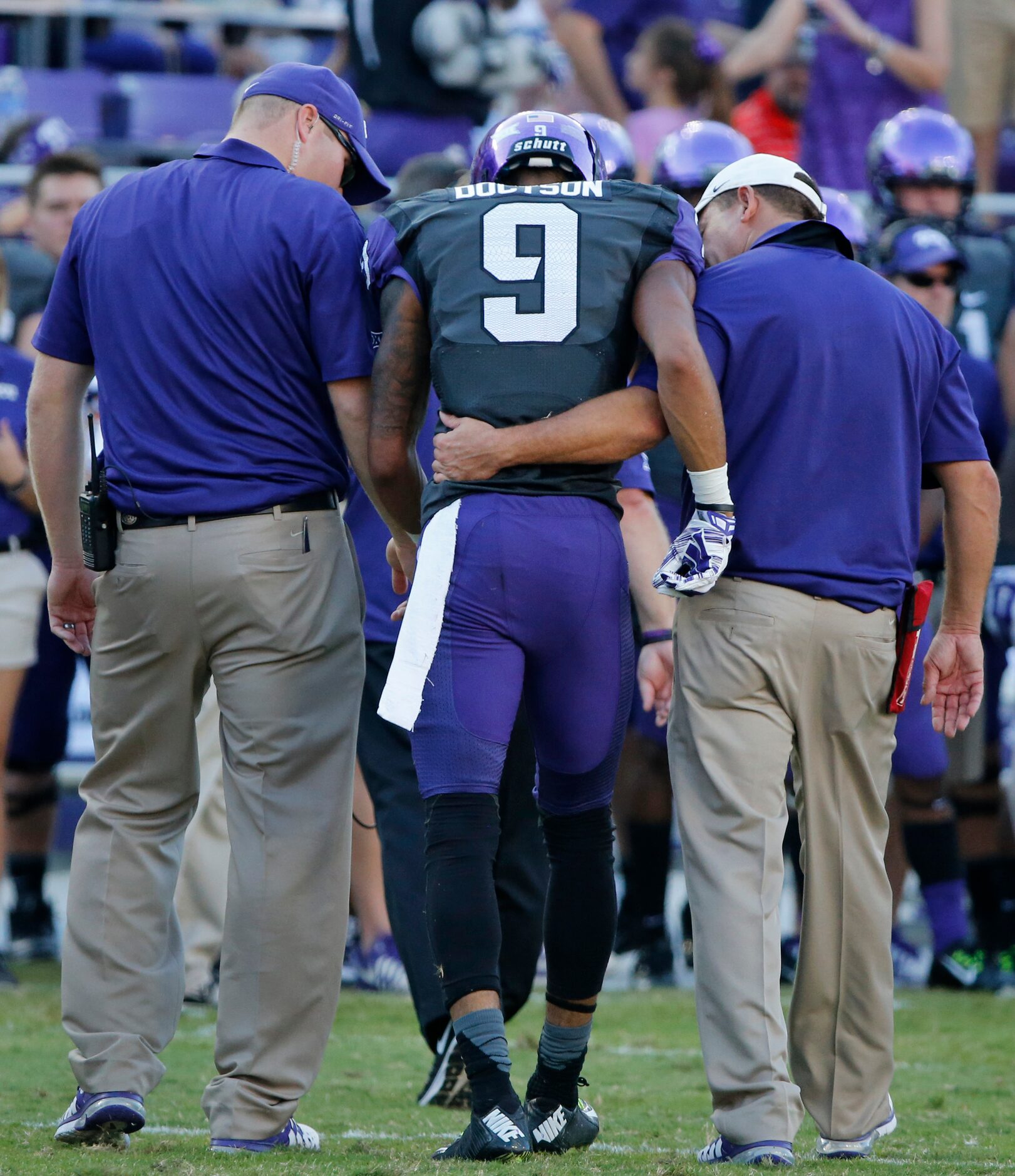 TCU receiver Josh Doctson (9) is helped off the field after being hurt after catching a pass...