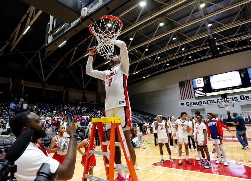 Kimball's Arterio Morris (2) cuts part of the net from a goal after his team’s 80-67 win...