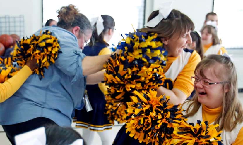 
Cheerleaders chase coach Missy Ruvaldt at the end of practice March 17 at Notre Dame School...