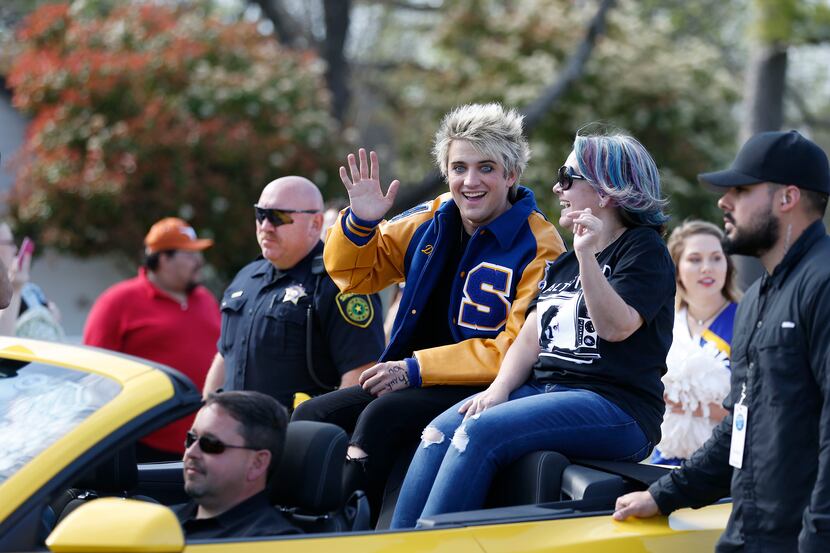 Dalton Rapattoni is joined by his mother, Kiva Rapattoni, in a parade during his hometown...