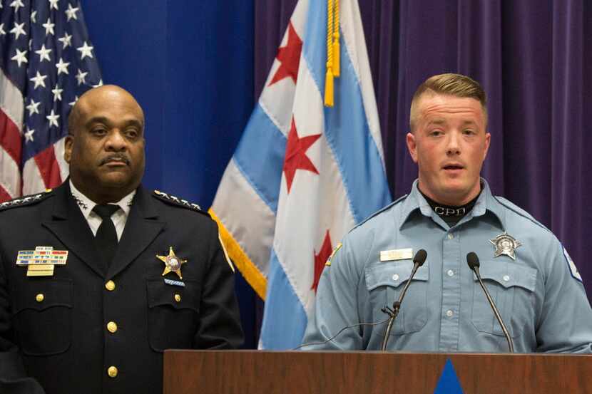 Chicago Police Officer Mike Donnelly, accompanied by Police Superintendent Eddie Johnson,...