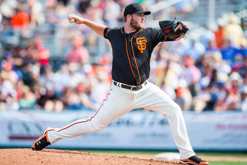 SCOTTSDALE, AZ - MARCH 2: Clayton Blackburn #52 of the San Francisco Giants pitches during a...
