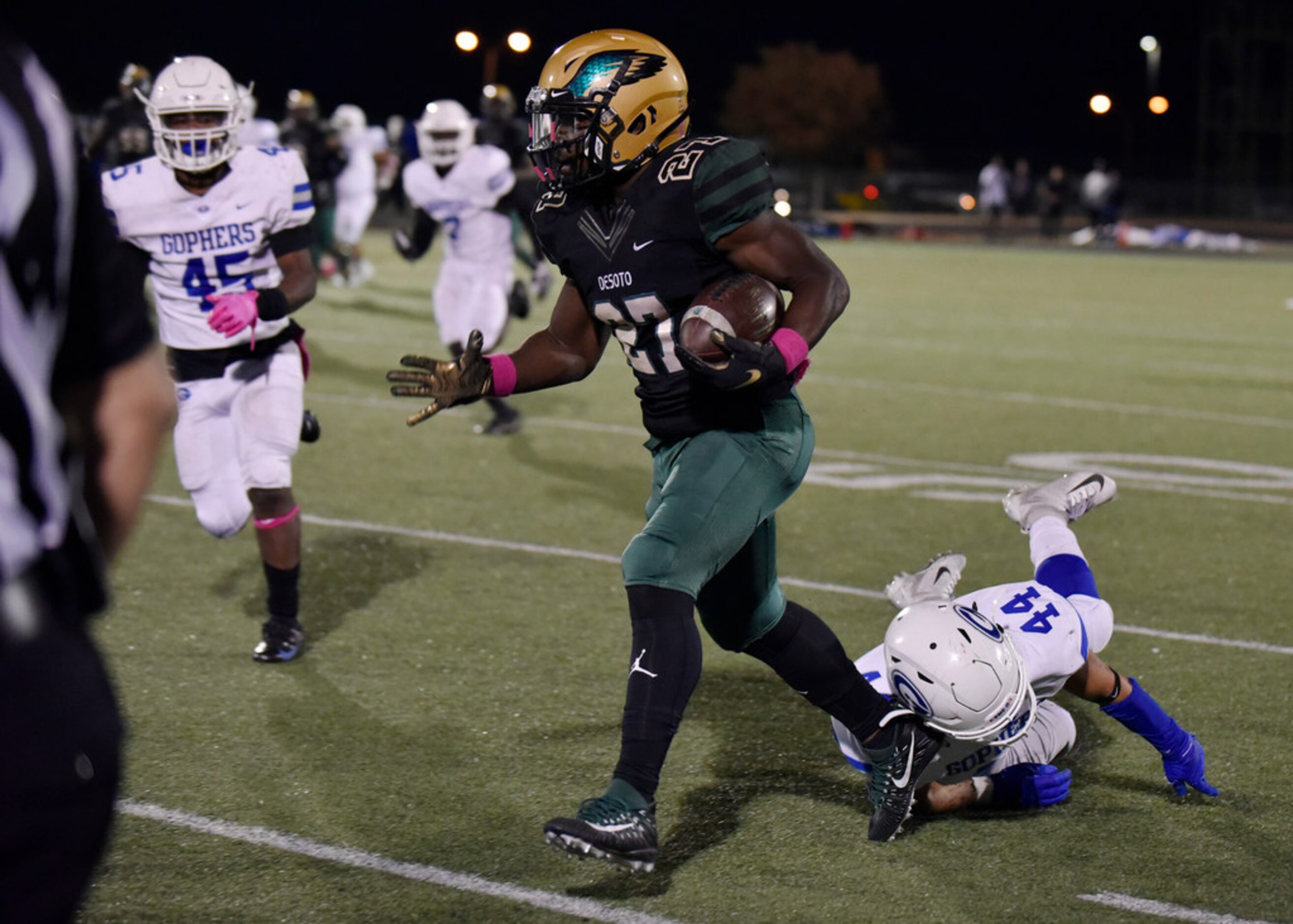 DeSoto High School senior running back Joshua Jackson (27) runs passed Grand Prairie High...