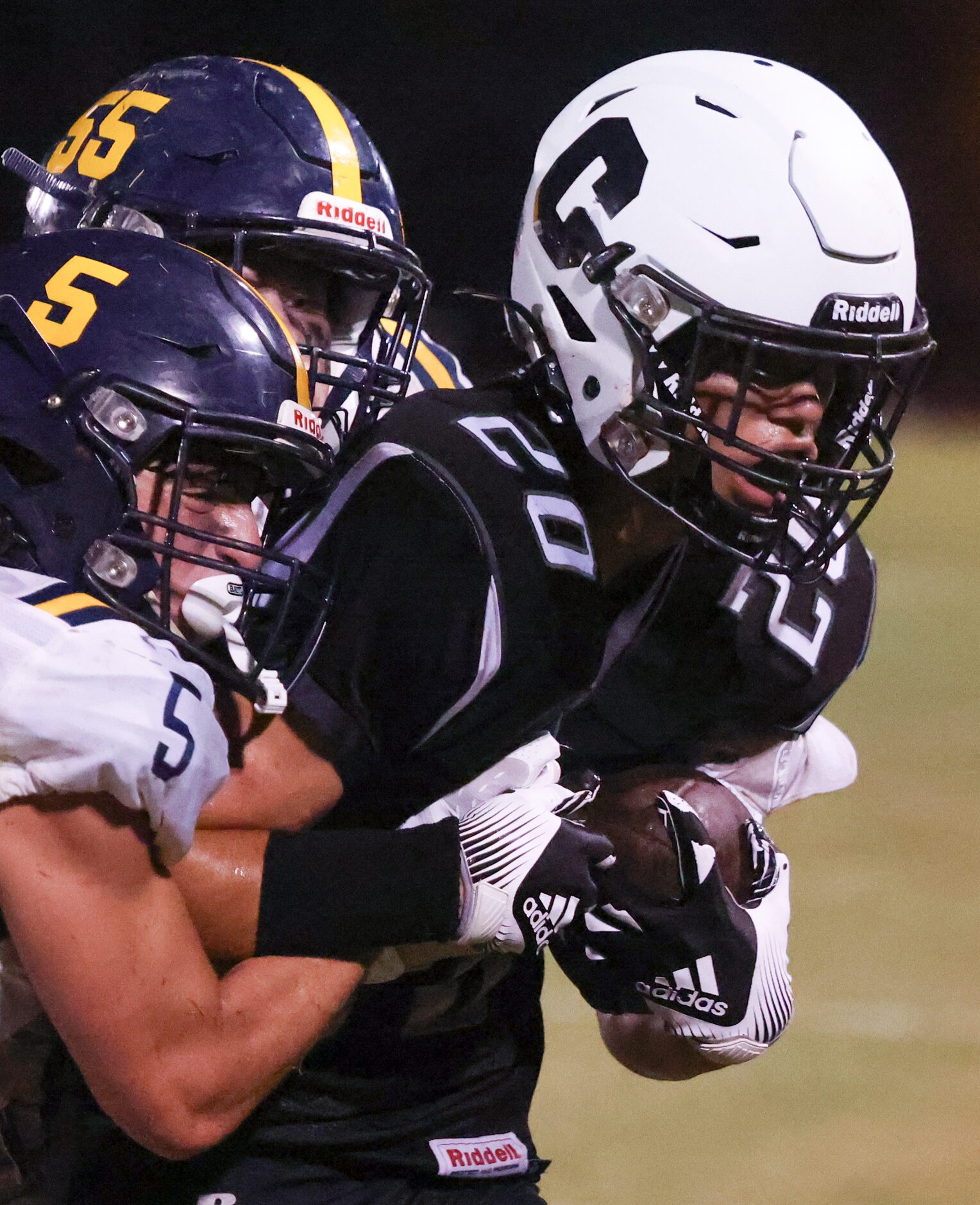 Cistercian Preparatory School Michael Peterman (20) gets grabbed by St. Mark's School of...