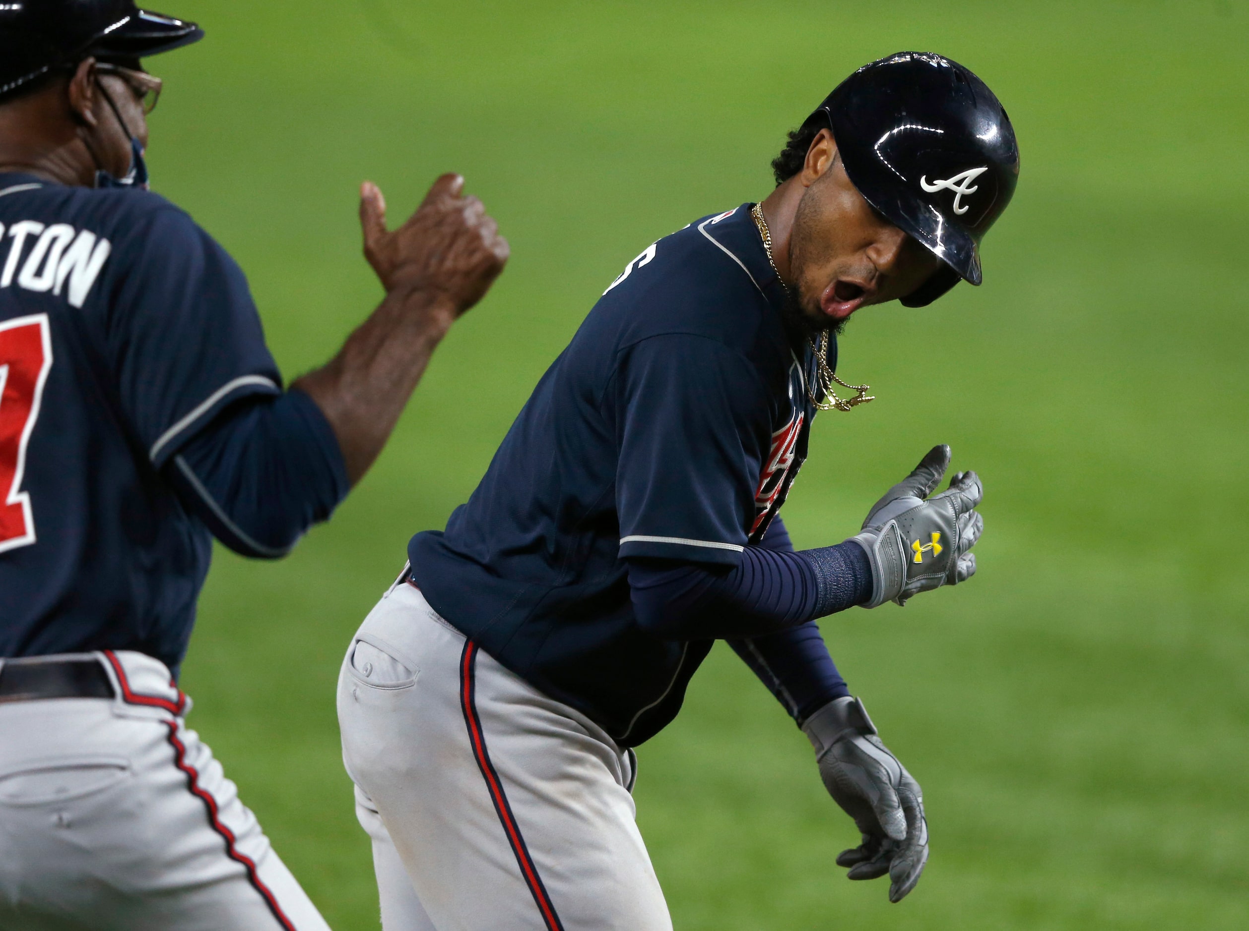 Atlanta Braves second baseman Ozzie Albies (1) celebrates with Atlanta Braves third base...