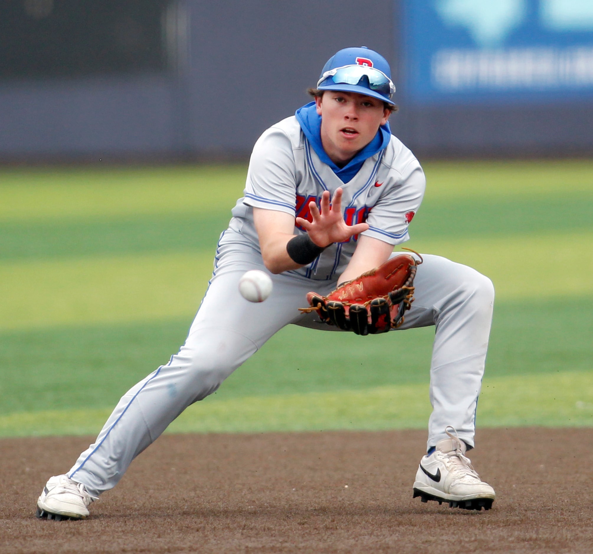 Parish Episcopal shortstop Daniel Parker (2) tracks a ground ball to his glove during team...