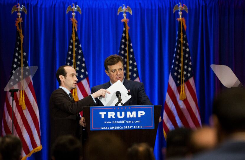 Campaign manager Paul Manafort (right) and senior adviser Stephen Miller talk before a June...