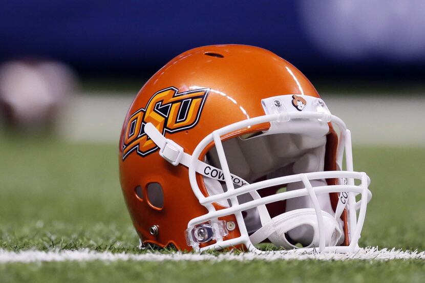 Sep 7, 2013; San Antonio, TX, USA; Oklahoma State Cowboys helmet sits on the field during...