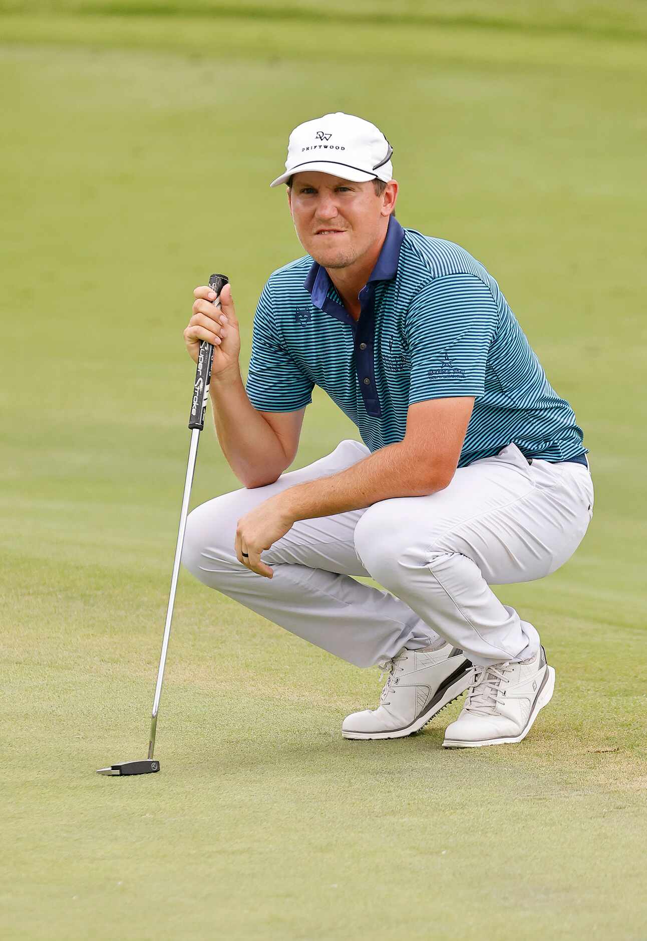 Professional golfer Kramer Hickok of Dallas studies the No. 16 green during round one of the...
