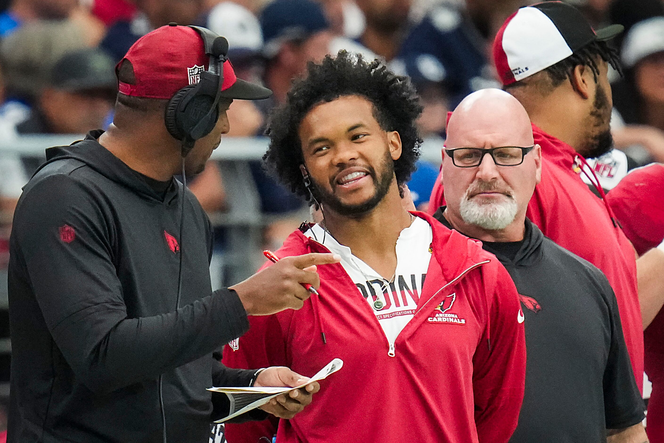 Arizona Cardinals quarterback Kyler Murray laughs on the sidelines during the first half of...