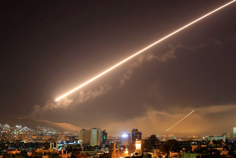Damascus skies erupt with surface to air missile fire as the U.S. launches an attack on...
