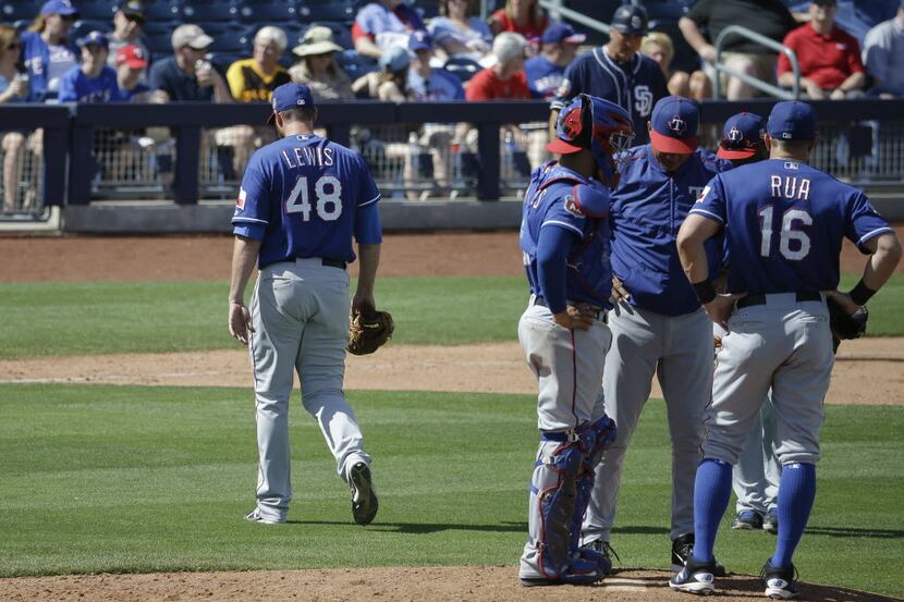 Texas Rangers starting pitcher Colby Lewis (48) is relieved in the fifth inning of a spring...
