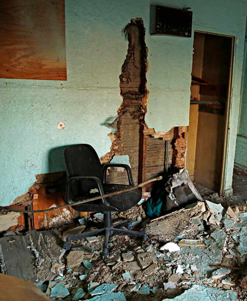 
An old office chair and other debris sit in what was the front office of the Mission Motel....