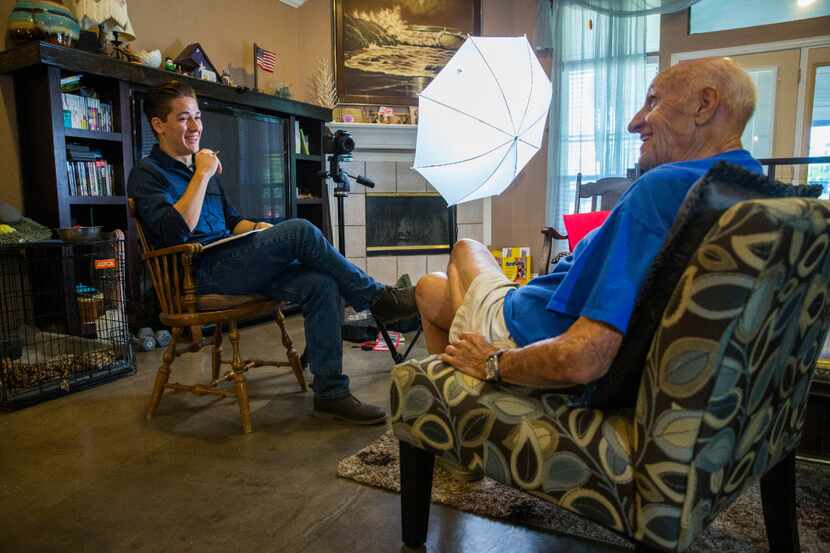 Andy Fancher, 18, interviews WWII U.S. Navy veteran Bob Gagnon, 92, on July 13 in Mansfield,...