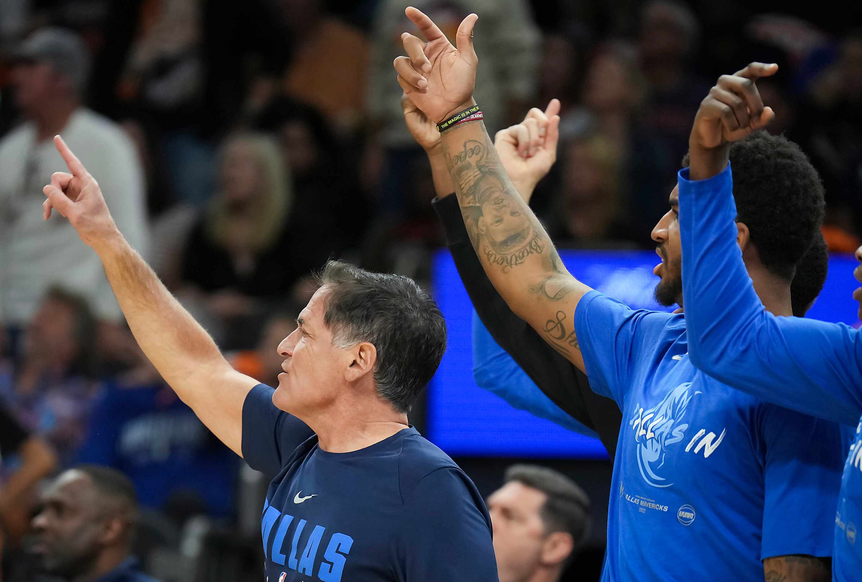 Dallas Mavericks owner Mark Cuban cheers from the bench during the third quarter in Game 2...