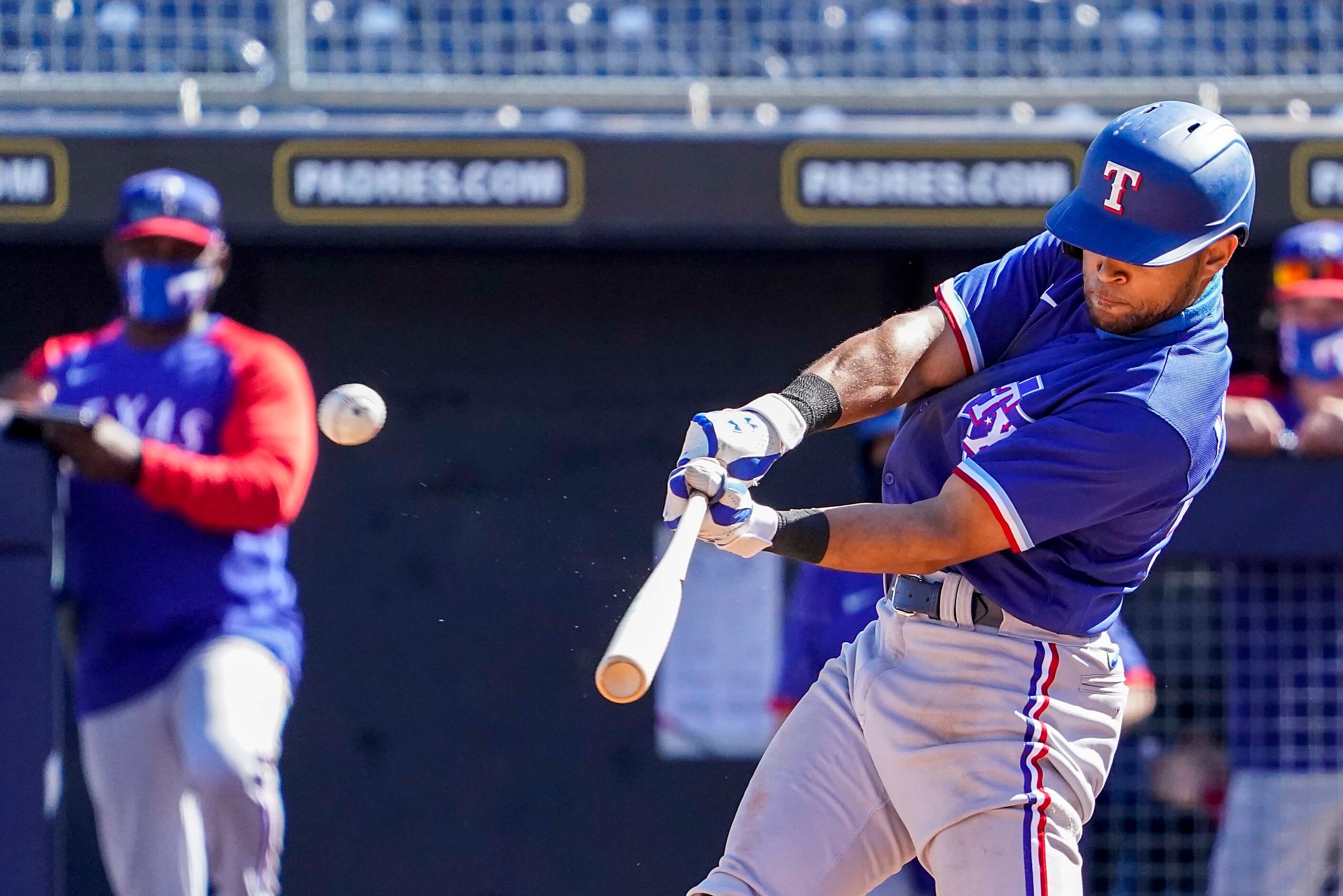 Texas Rangers outfielder Jason Martin hits a solo home run during the fifth inning of a...