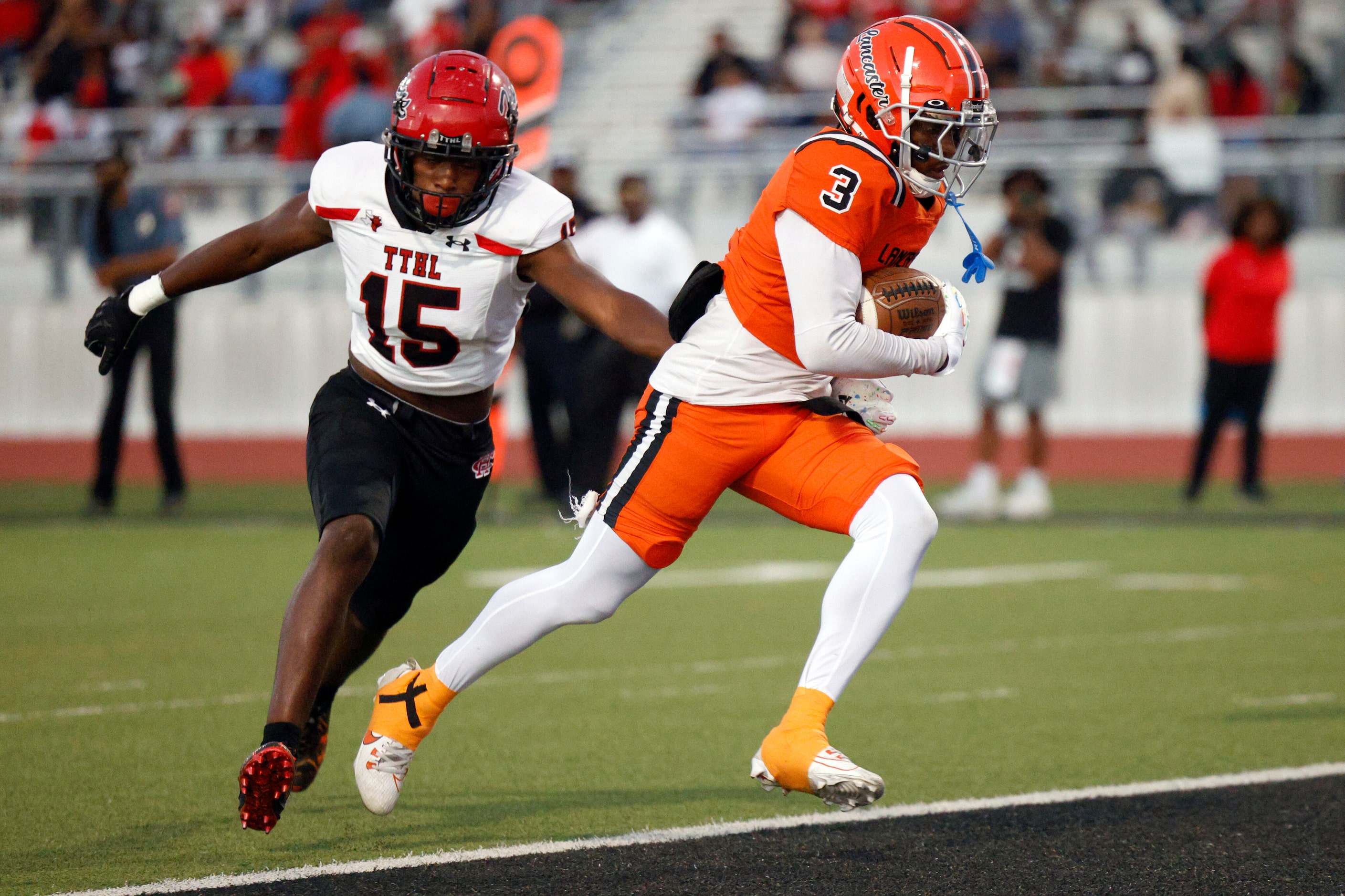 Lancaster wide receiver Ja’Quavius Pipkin (3) runs for a touchdown after a catch ahead of...