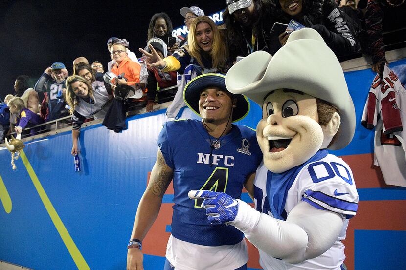 NFC quarterback Dak Prescott (4), of the Dallas Cowboys, poses with the Cowboys mascot on...