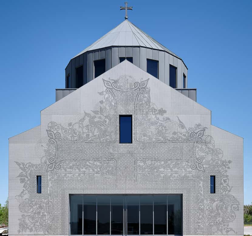 Viewed from a distance, the 1.5 million glyphs or "pixels" on the church's facade coalesce...