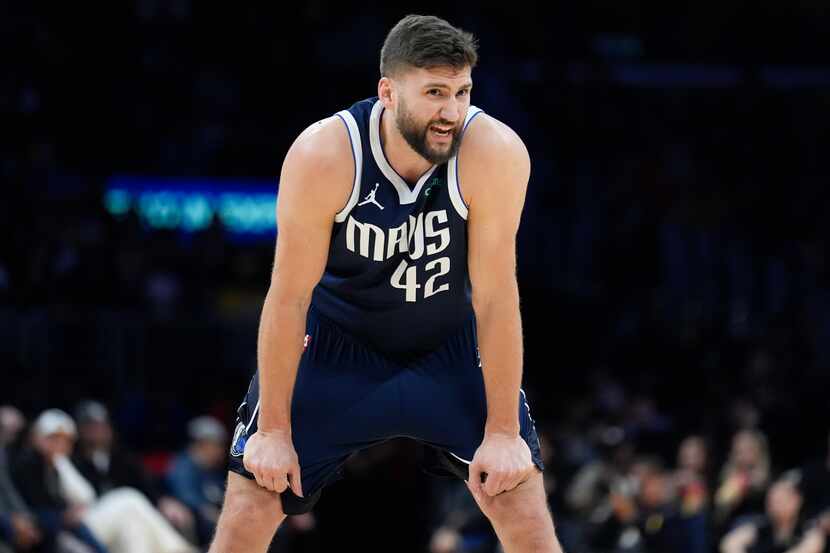 Dallas Mavericks forward Maxi Kleber (42) talks to a teammate during the first half of an...