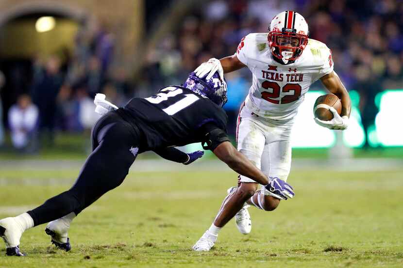 Texas Tech Red Raiders wide receiver Seth Collins (22) taps TCU Horned Frogs safety Ridwan...