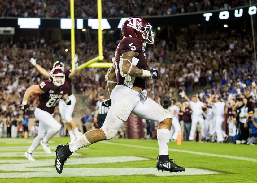 FILE - Texas A&M Aggies running back Trayveon Williams (5) celebrates scoring the game...