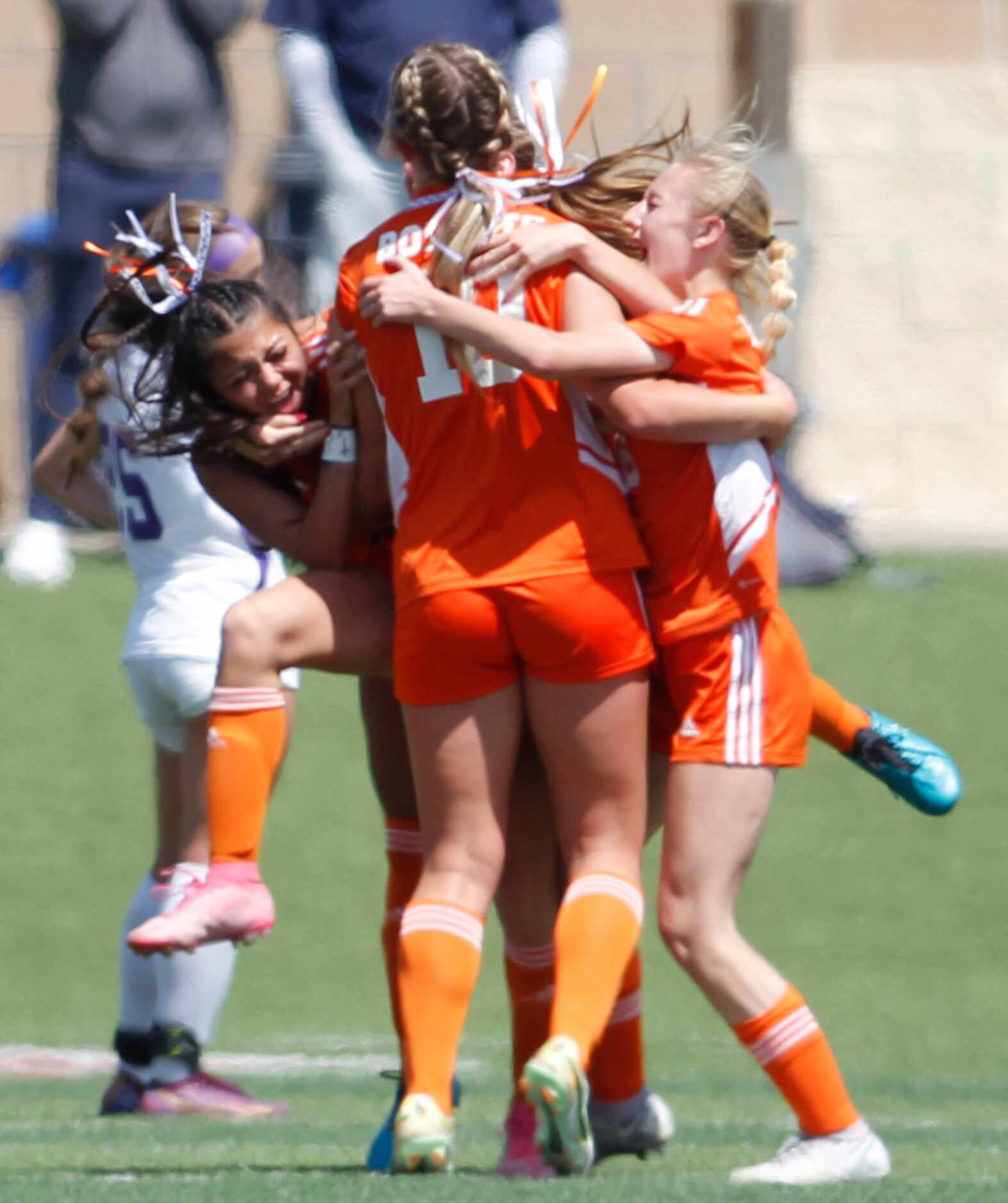 Celina's Mia Norman (10) is mobbed by teammates Brielle Buchanan (5), left, and Ryleigh...