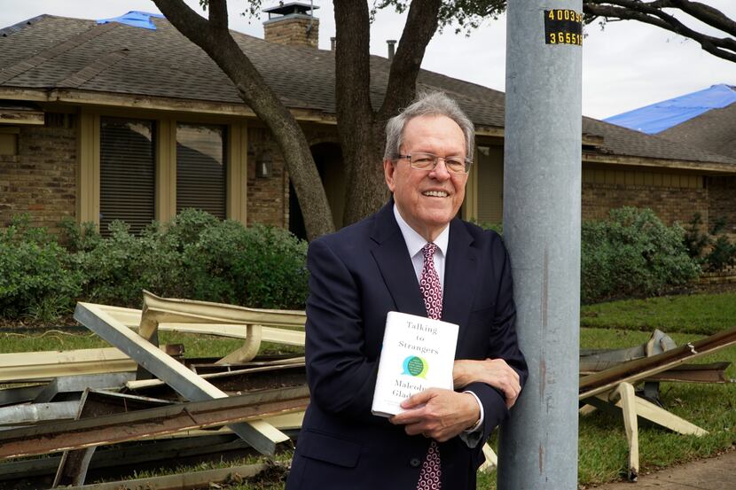 Randy Mayeux poses with Malcolm Gladwell's book "Talking to Strangers" at his home in...