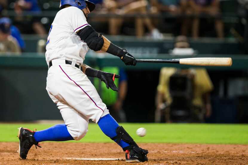 Texas Rangers second baseman Rougned Odor (12) fouls a ball off his right foot during the...