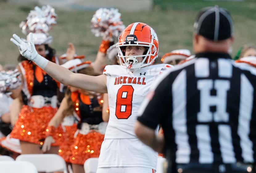 Rockwall's Triston Gooch (center) celebrates his touchdown against Rockwall-Heath during the...