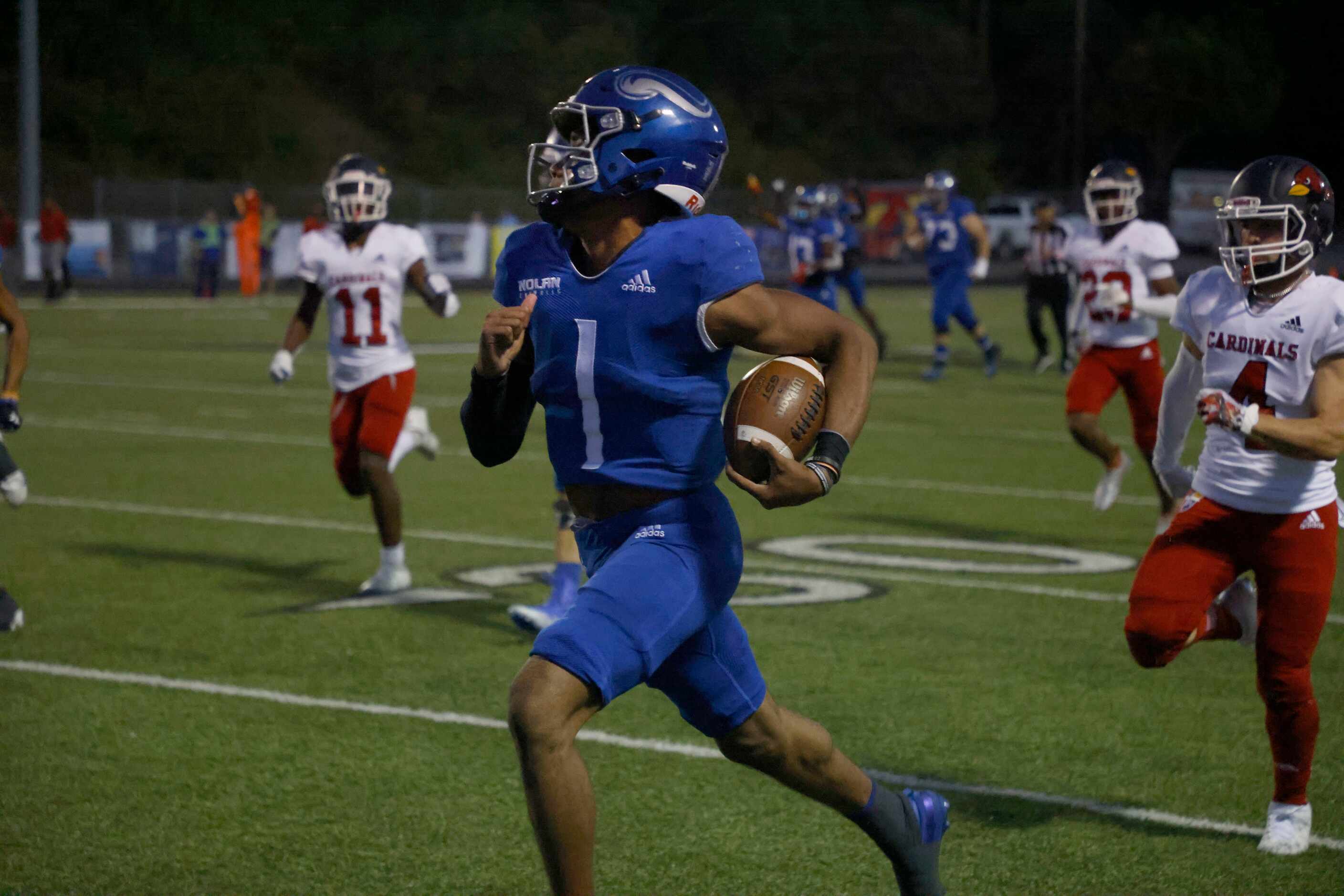 Nolan’s TJ Williams (1) runs for a touchdown as he is chased by John Paul II’s Ceasar Alex...