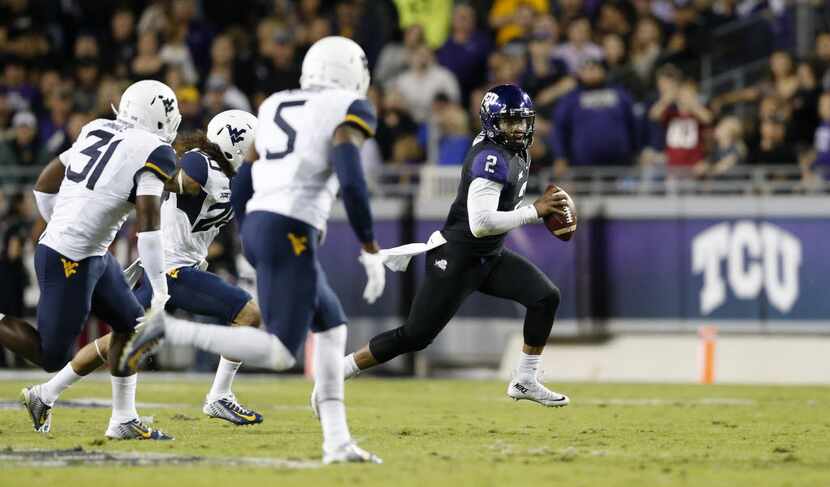 TCU Horned Frogs quarterback Trevone Boykin (2) breaks away from the West Virginia...