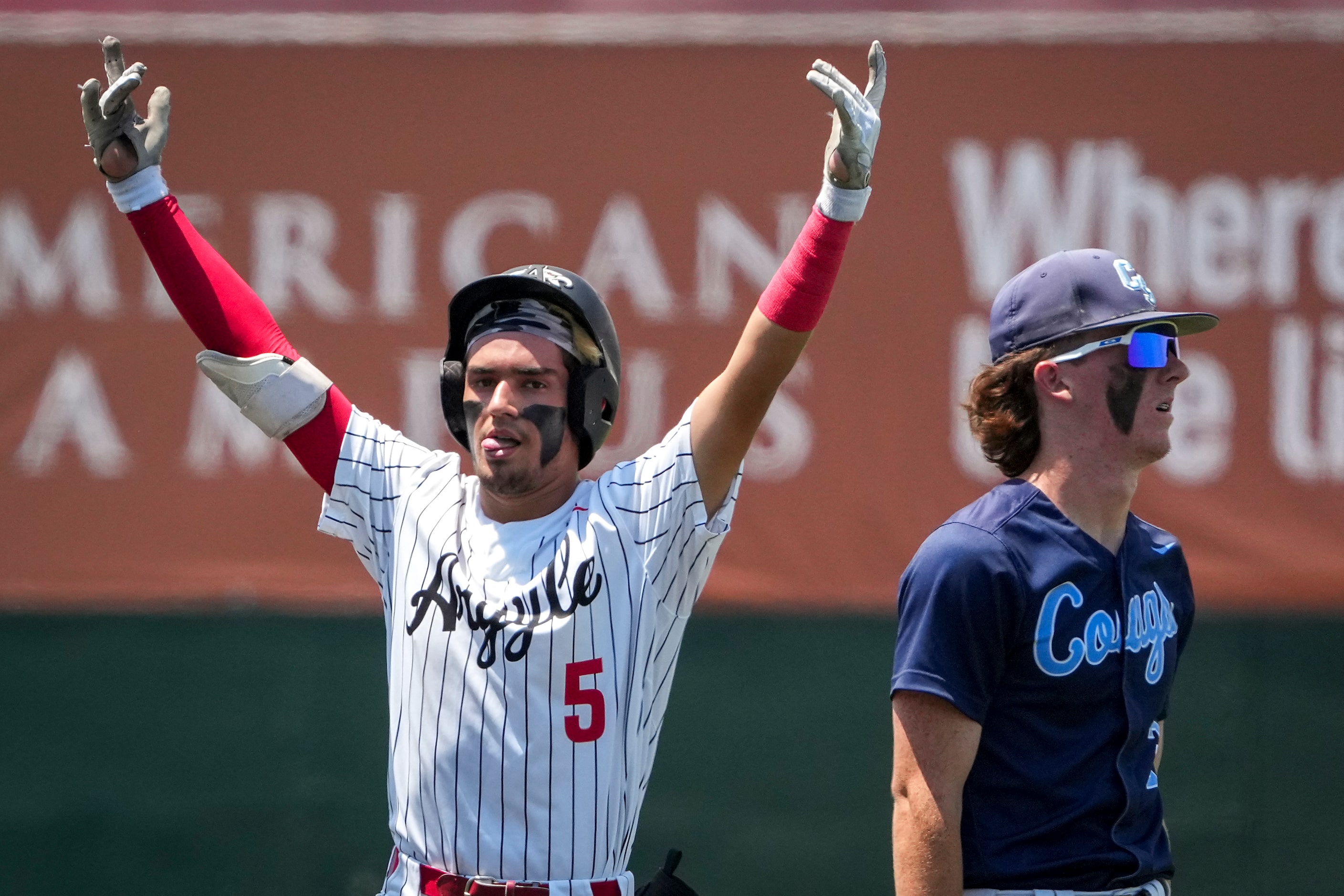 Argyle second baseman Colton Roquemore (5) celebrates as second base after reaching on a...