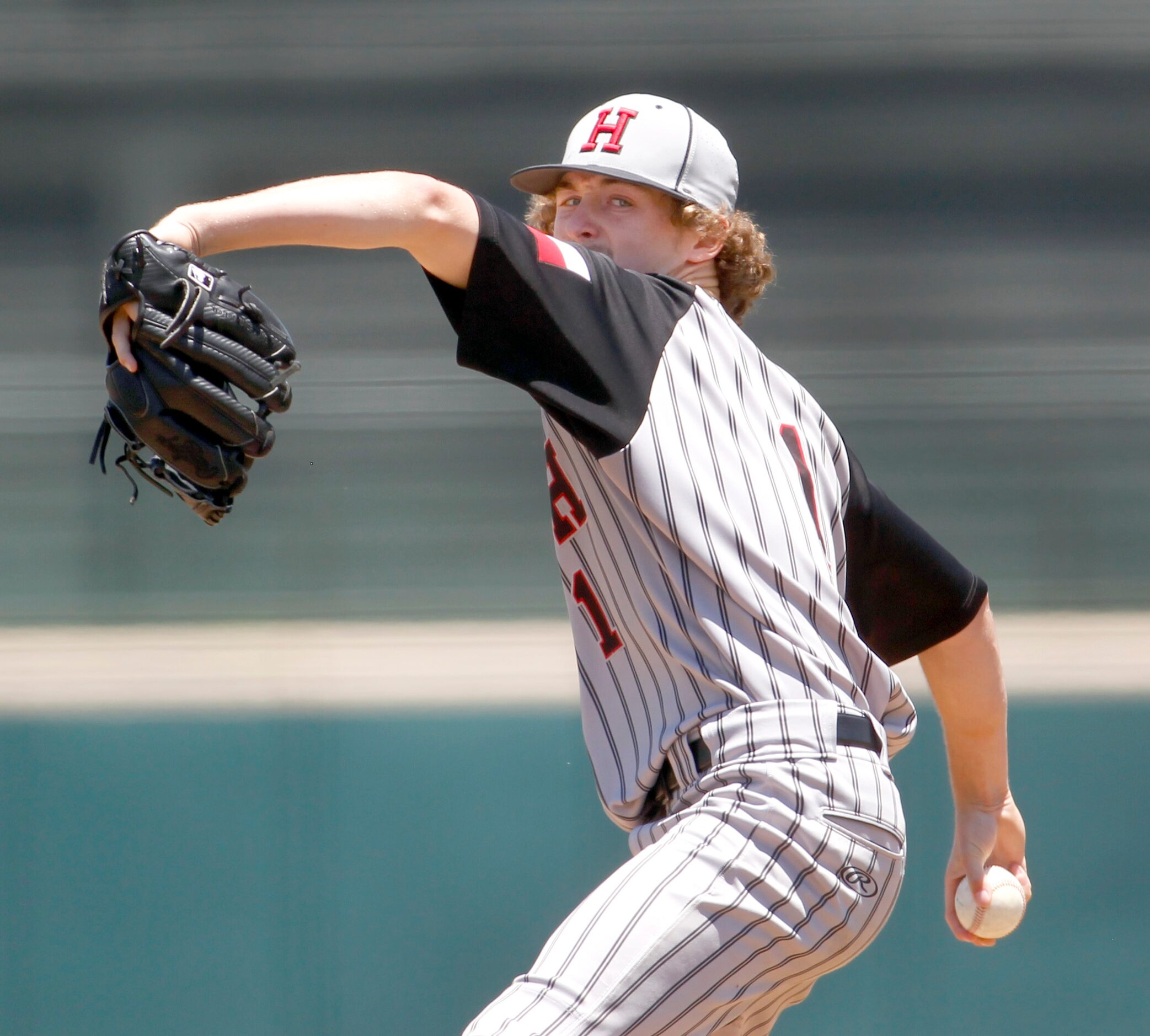 Rockwall Heath pitcher Baylor Baumann (1) delivers a pitch to a Rockwall batter during the...