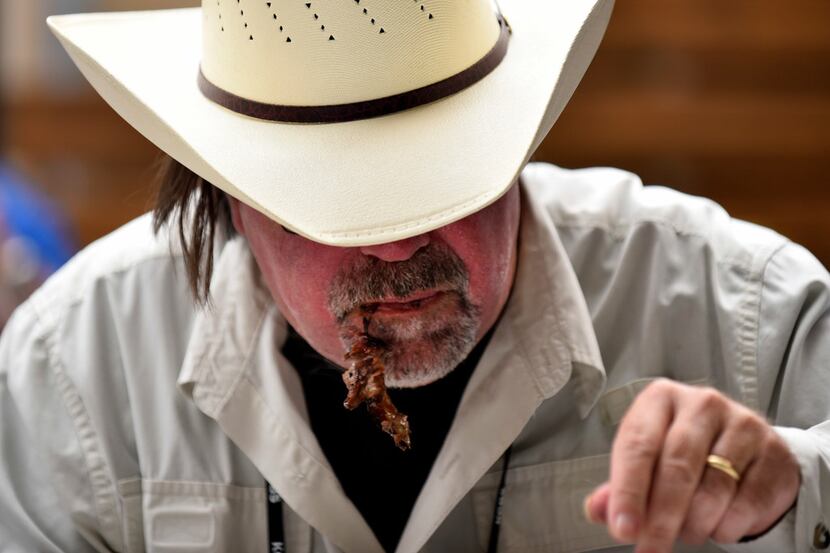 Certified barbeque judge Larry Moody of Dallas judges beef rib during the Dallas Kosher BBQ...
