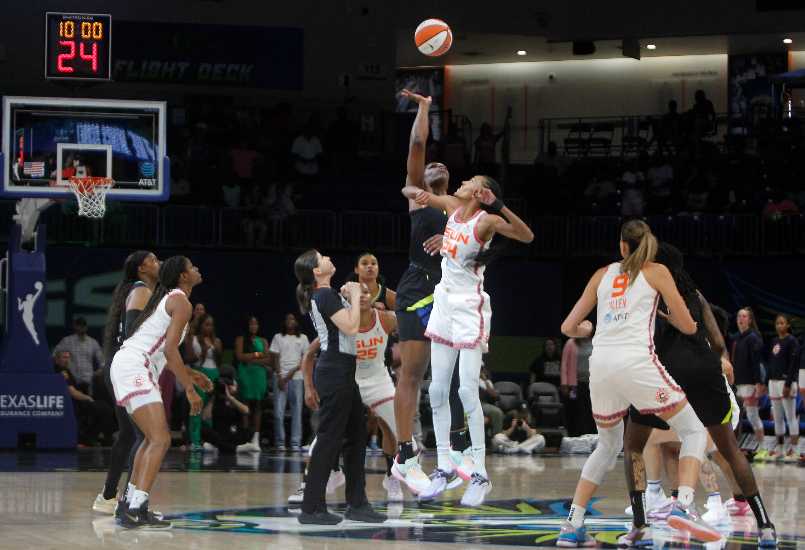 Dallas Wings center Teaira McCowan (7) commands the tip off of the first half action against...