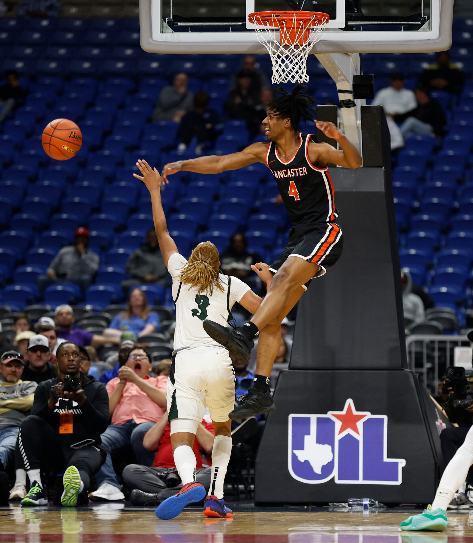 Lancaster's Dillon Battie (4) blocks a shot from Killeen Ellison's Nasaun Parker (3) in the...