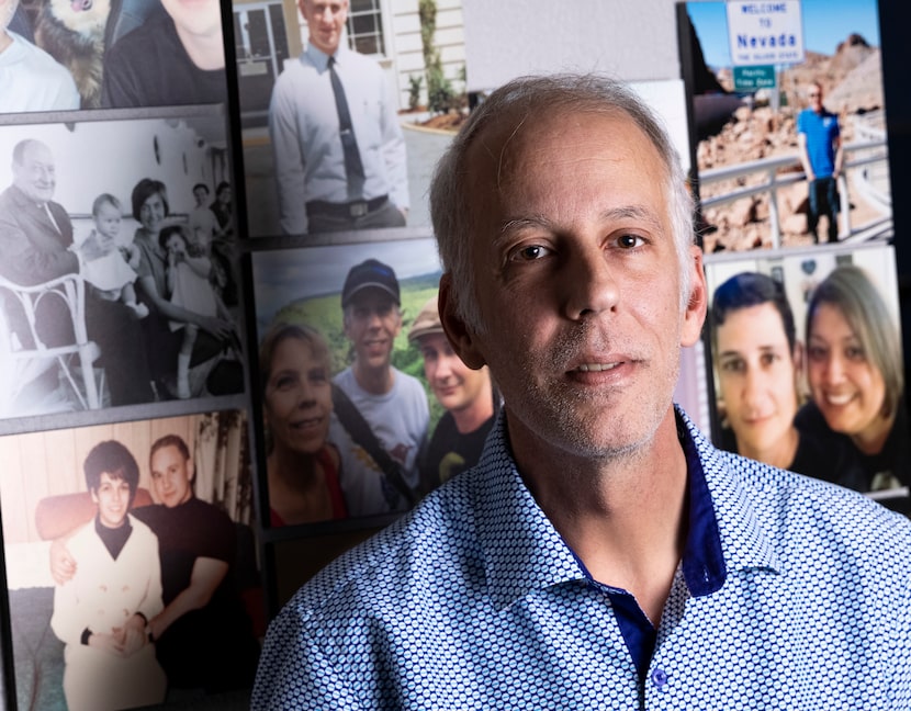 Paul Stubbs, the husband of Patrick Willis Anthony Bailey, stands in front of photos of the...