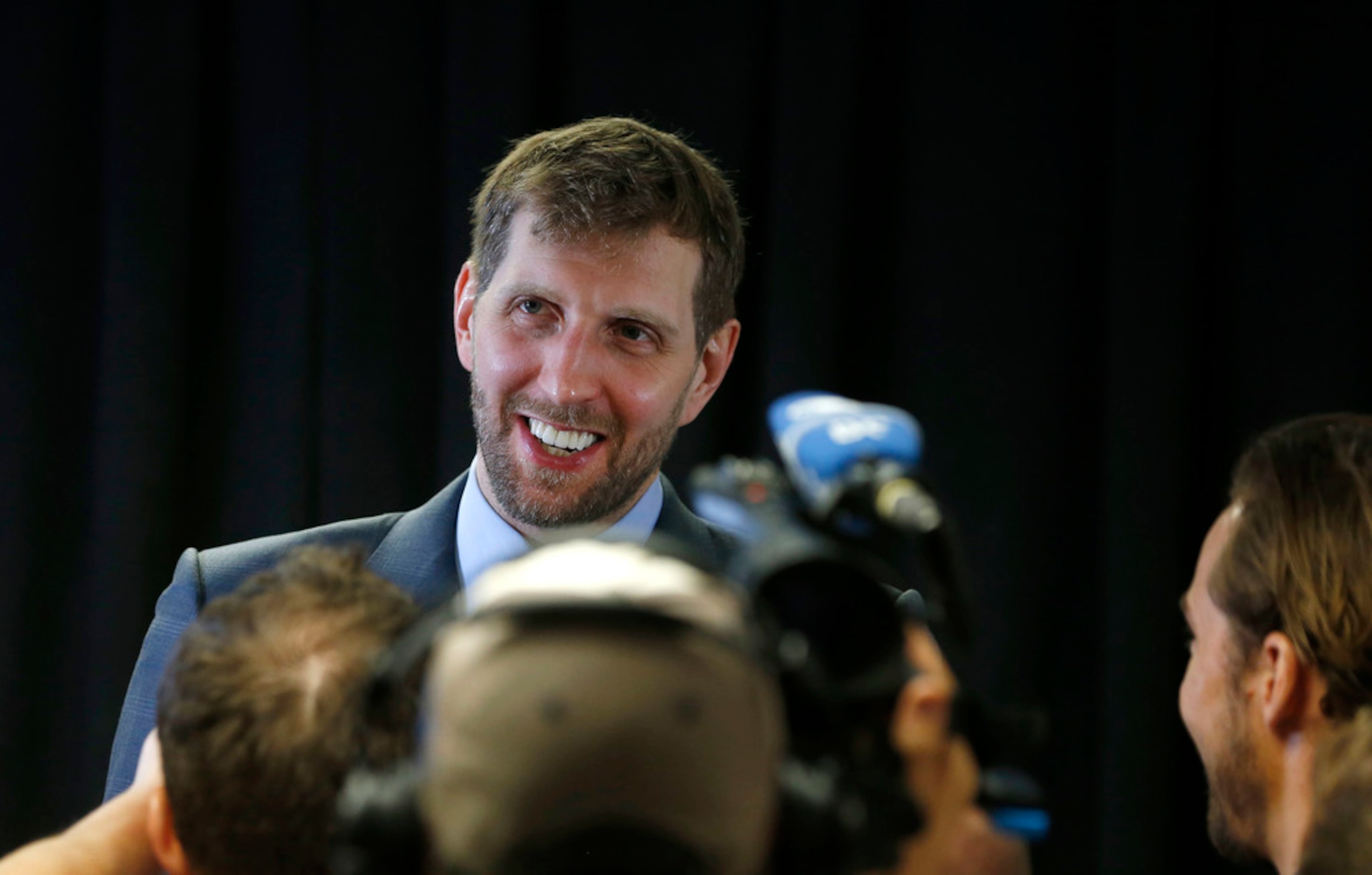 Dallas Mavericks forward Dirk Nowitzki (41) answers questions for the German media after his...