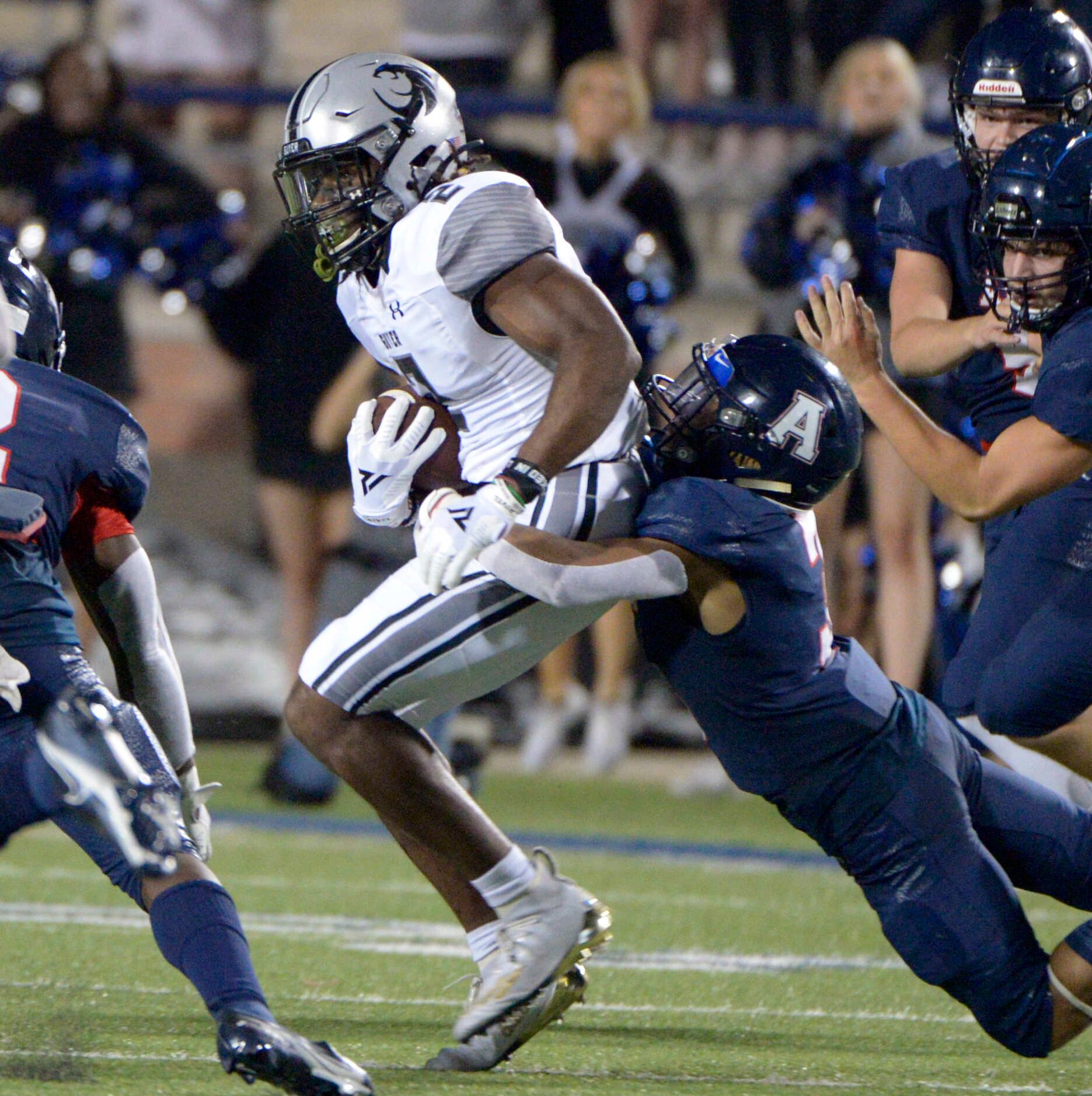 Denton Guyer’s Deuce Harmon (2) runs upfield on a punt return in the third quarter of a high...