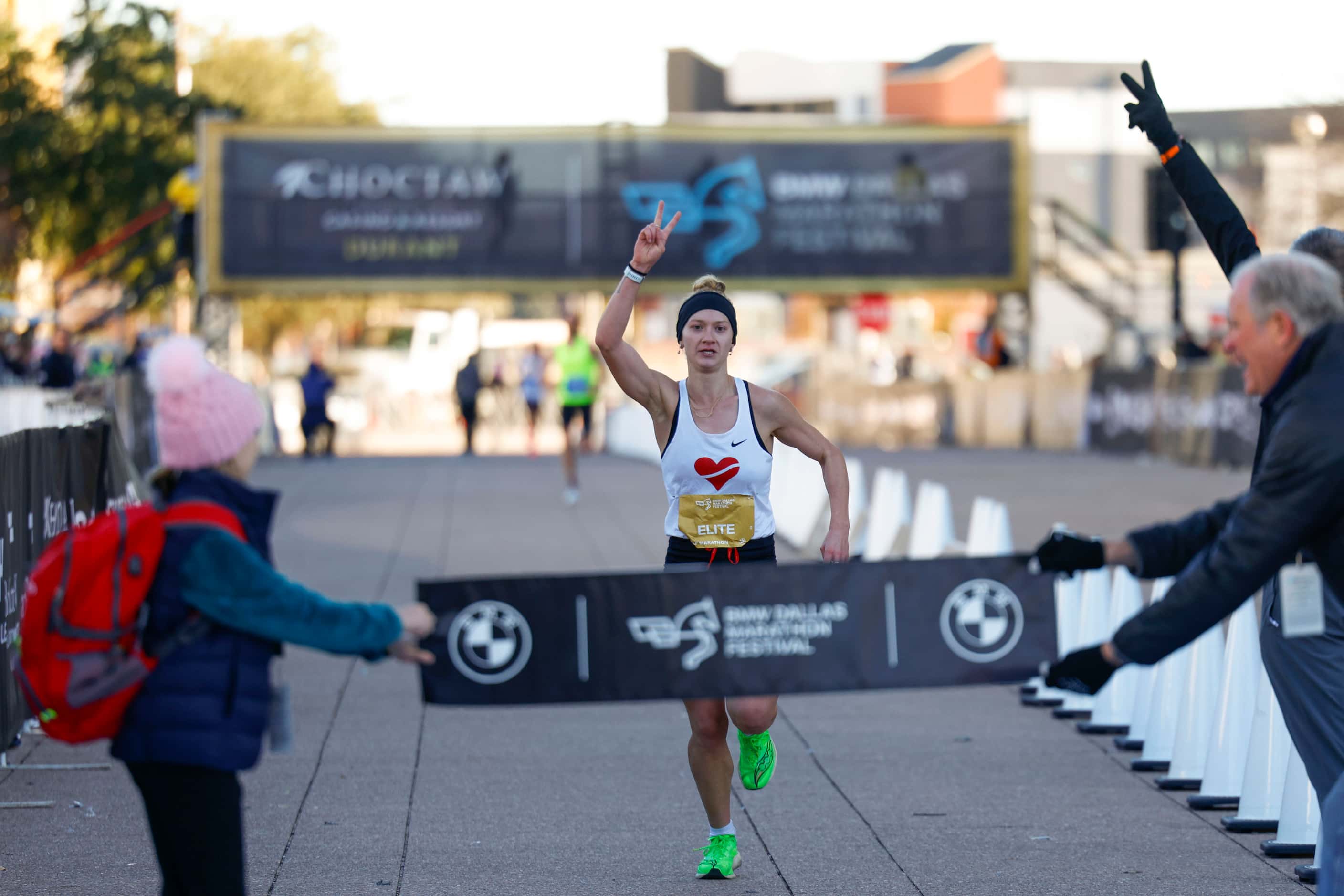 Women’s half marathon finisher Mimi Smith, 26, of Chicago, celebrates coming close to the...