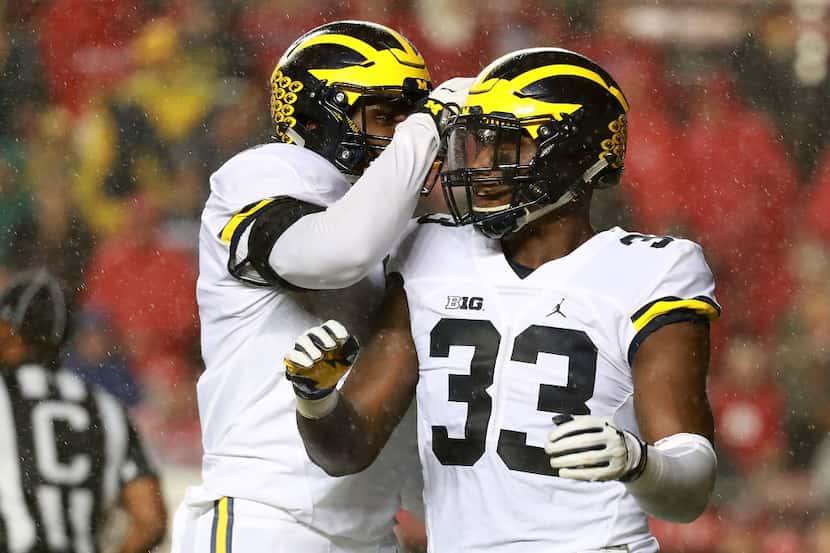 PISCATAWAY, NJ - OCTOBER 08:  Taco Charlton #33 of the Michigan Wolverines celebrates with...