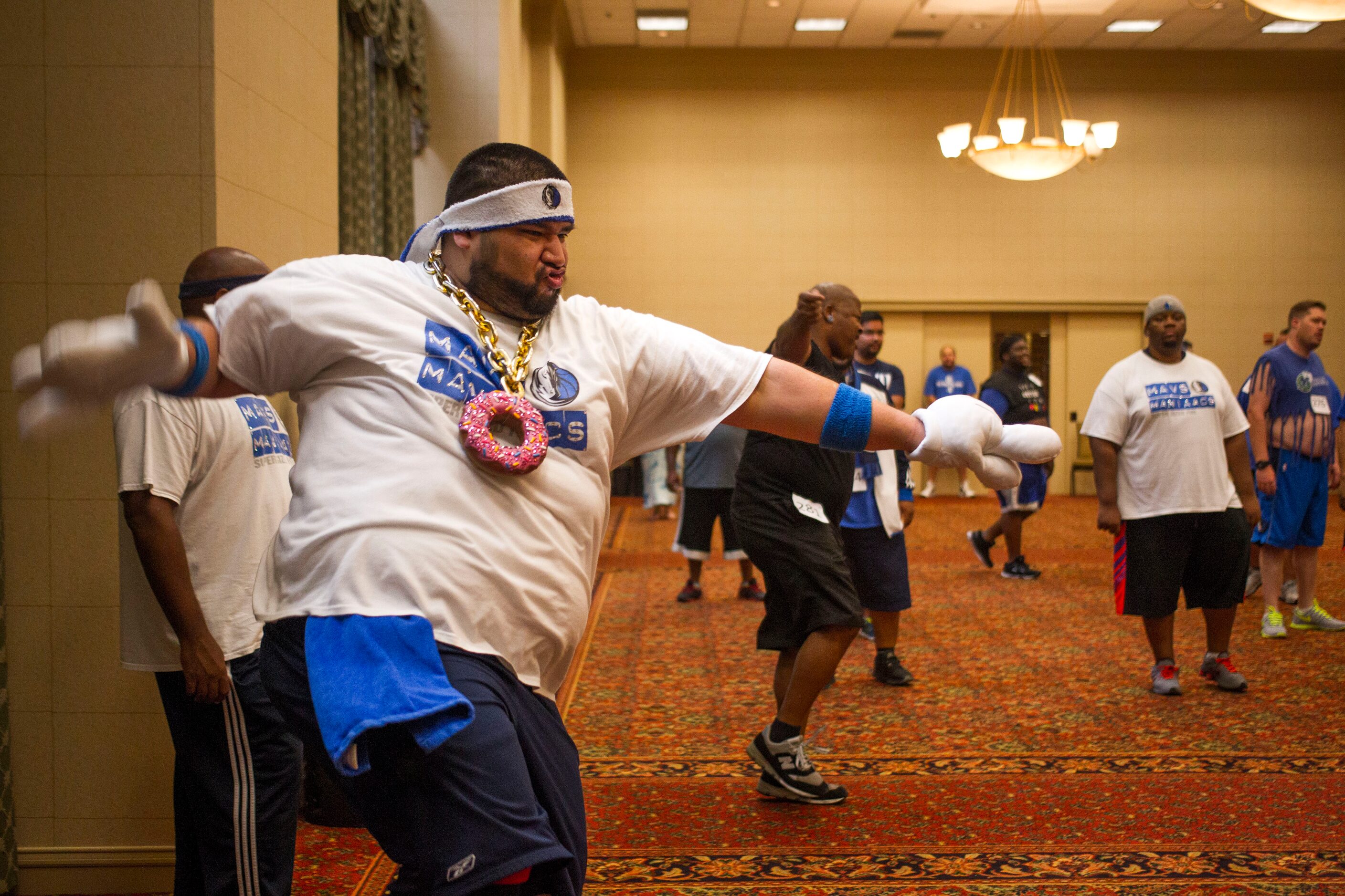 "Ositio," team member of The Mavs ManiAACs for nine years, dances during team tryouts, which...