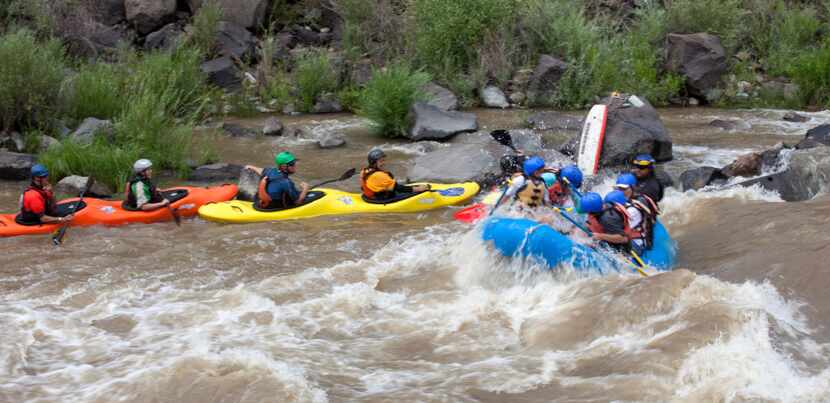 Kayaking and rafting the whitewater in the Rio Grande Gorge.